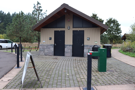 Restrooms, drinking fountain, garbage can and bike rack – near parking lot